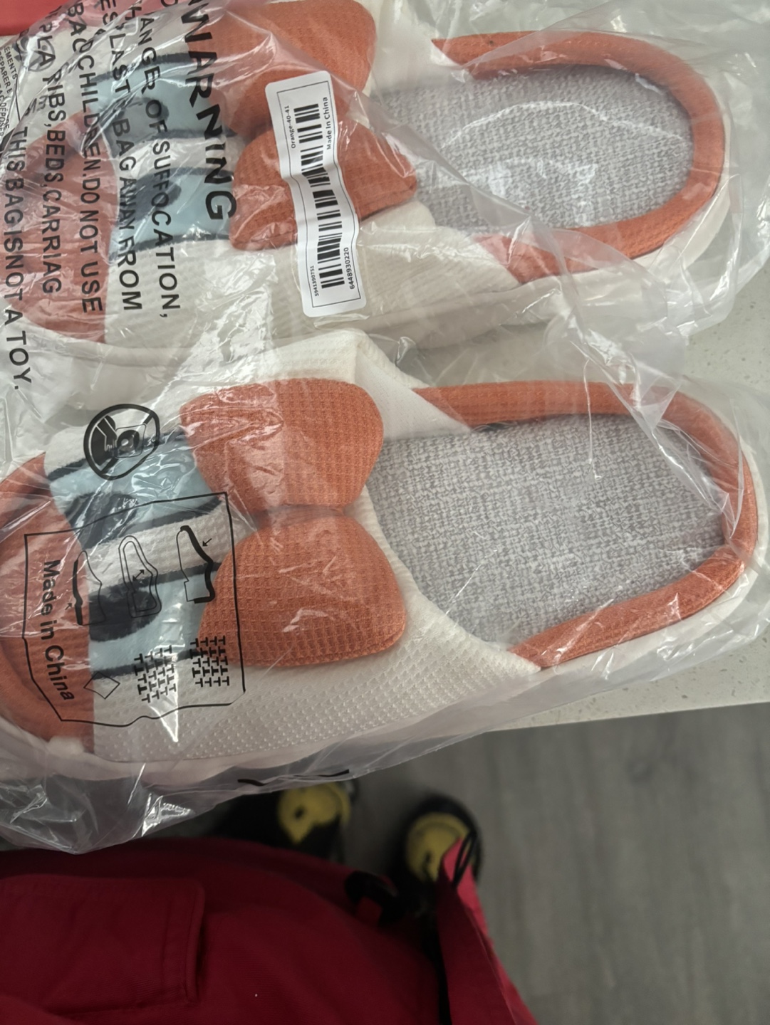 Orange and white slippers