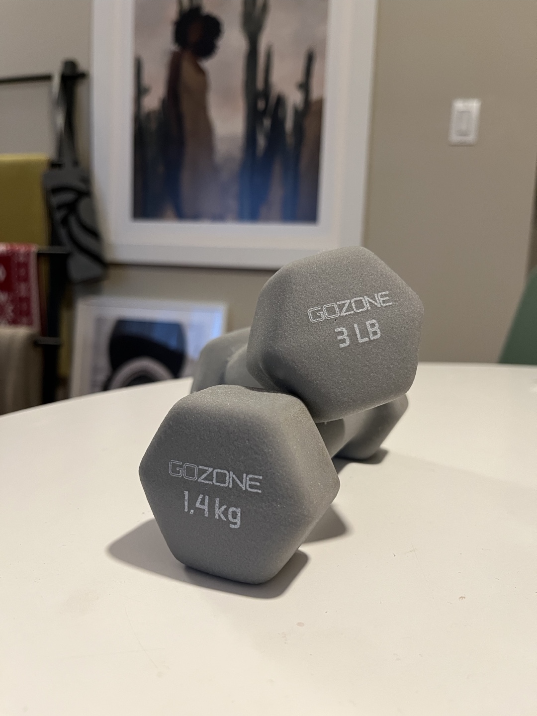 A set of grey, 3 lb dumbbells