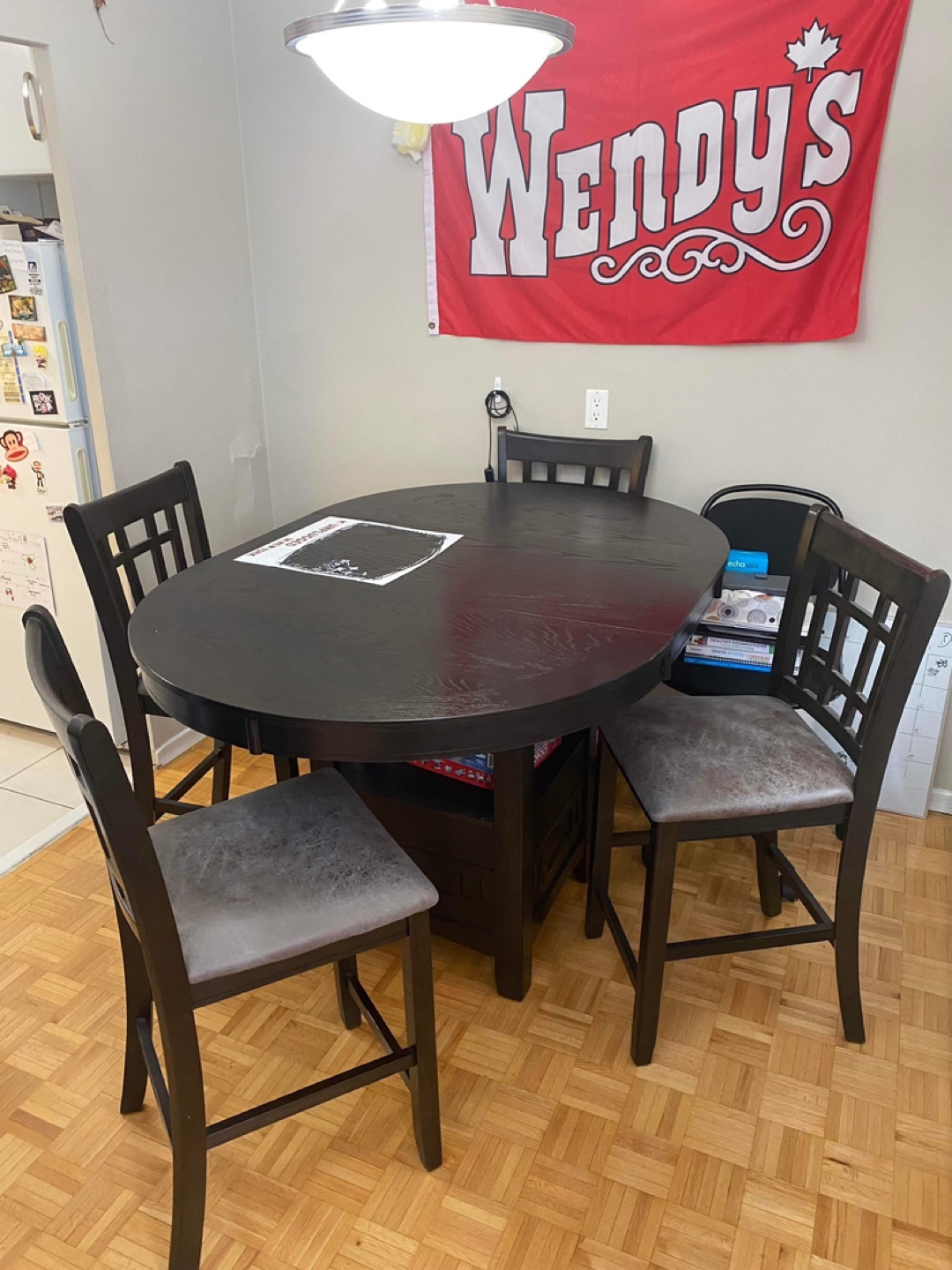 Brown dining table with four chairs