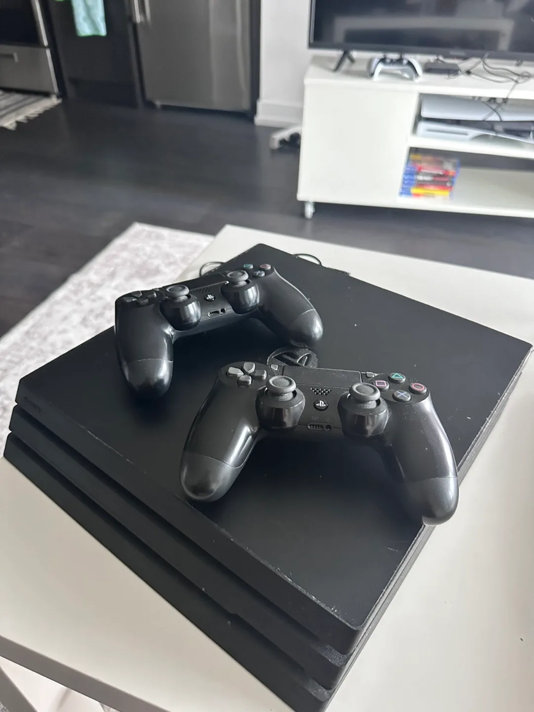 PS4 Pro with 2 Controllers & 4 Games image indicator(4)