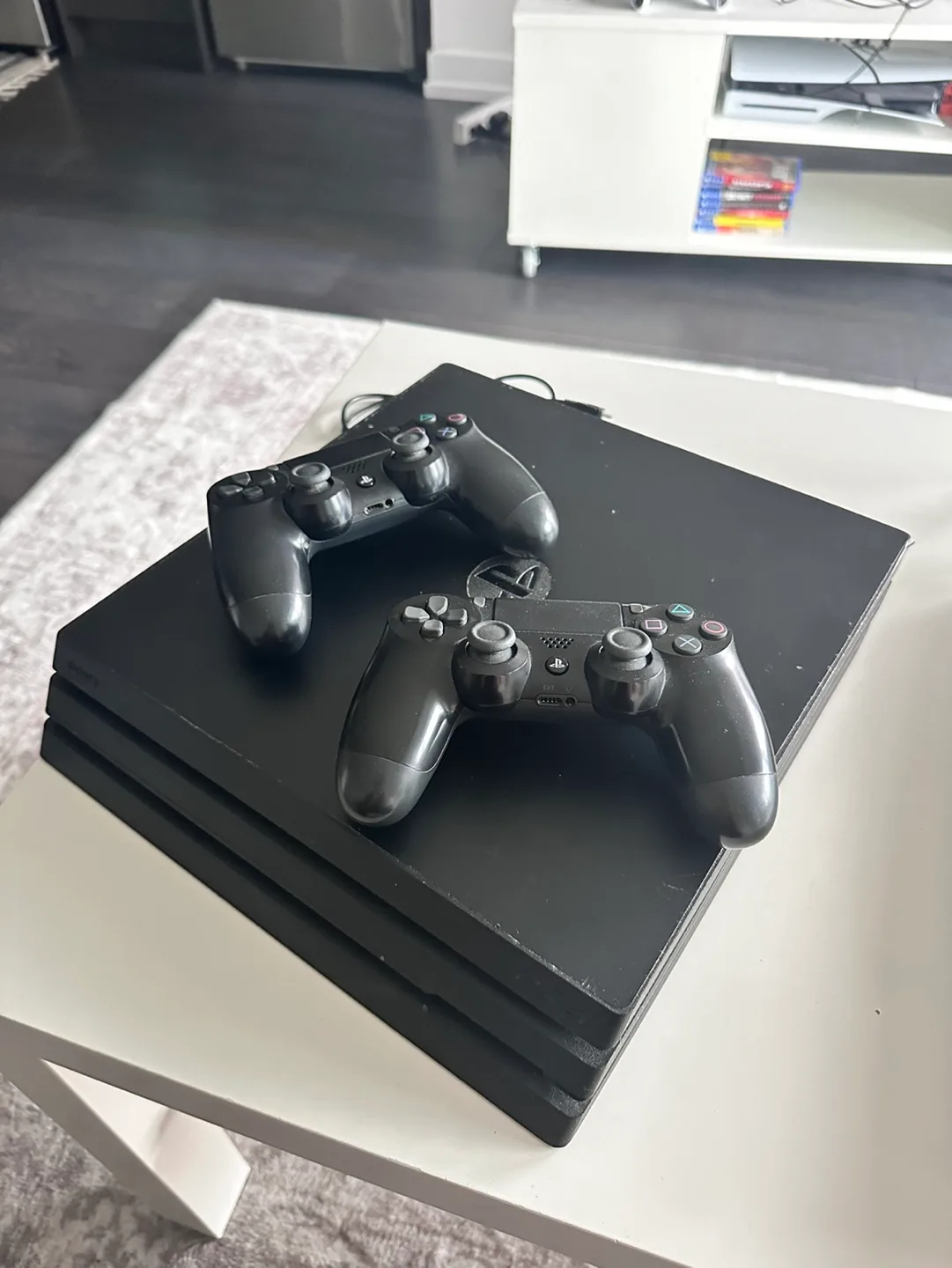 PS4 Pro with 2 Controllers & 4 Games image indicator(3)