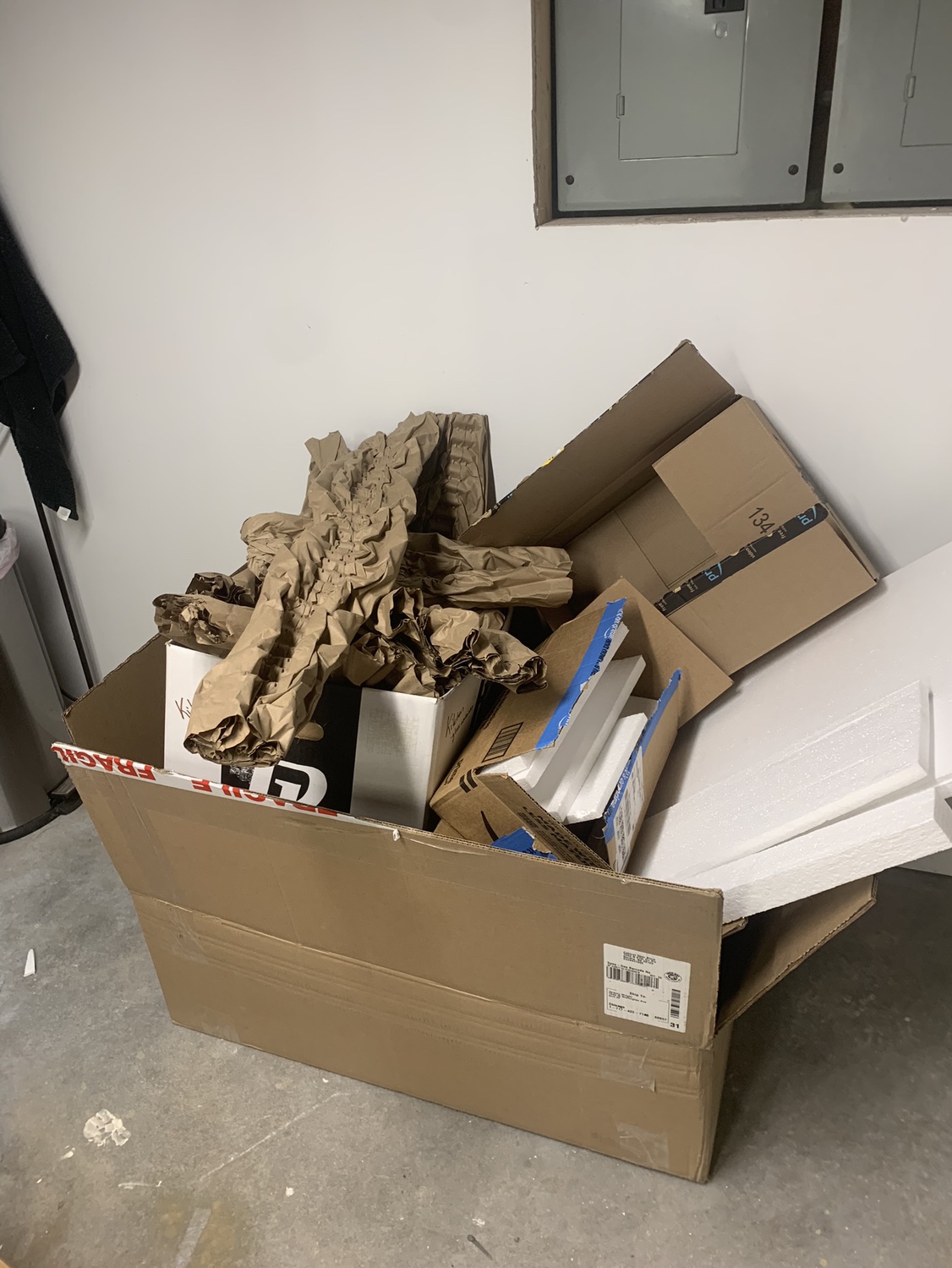 Large Box of Packing Paper and white styrofoam