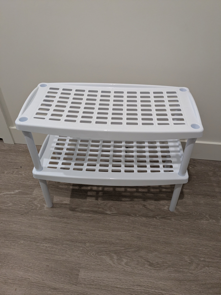 White plastic shelves/shoe rack