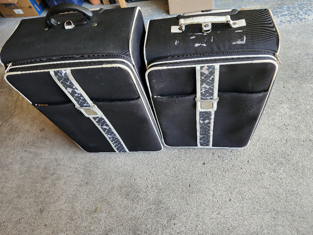 Set of Two Black Suitcases with White Trim