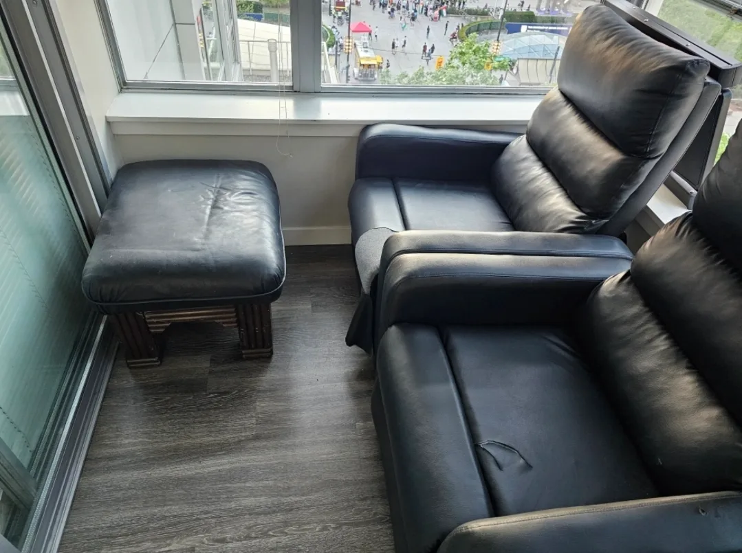 Stortage unit with Two Black Recliners with Ottoman image indicator(2)