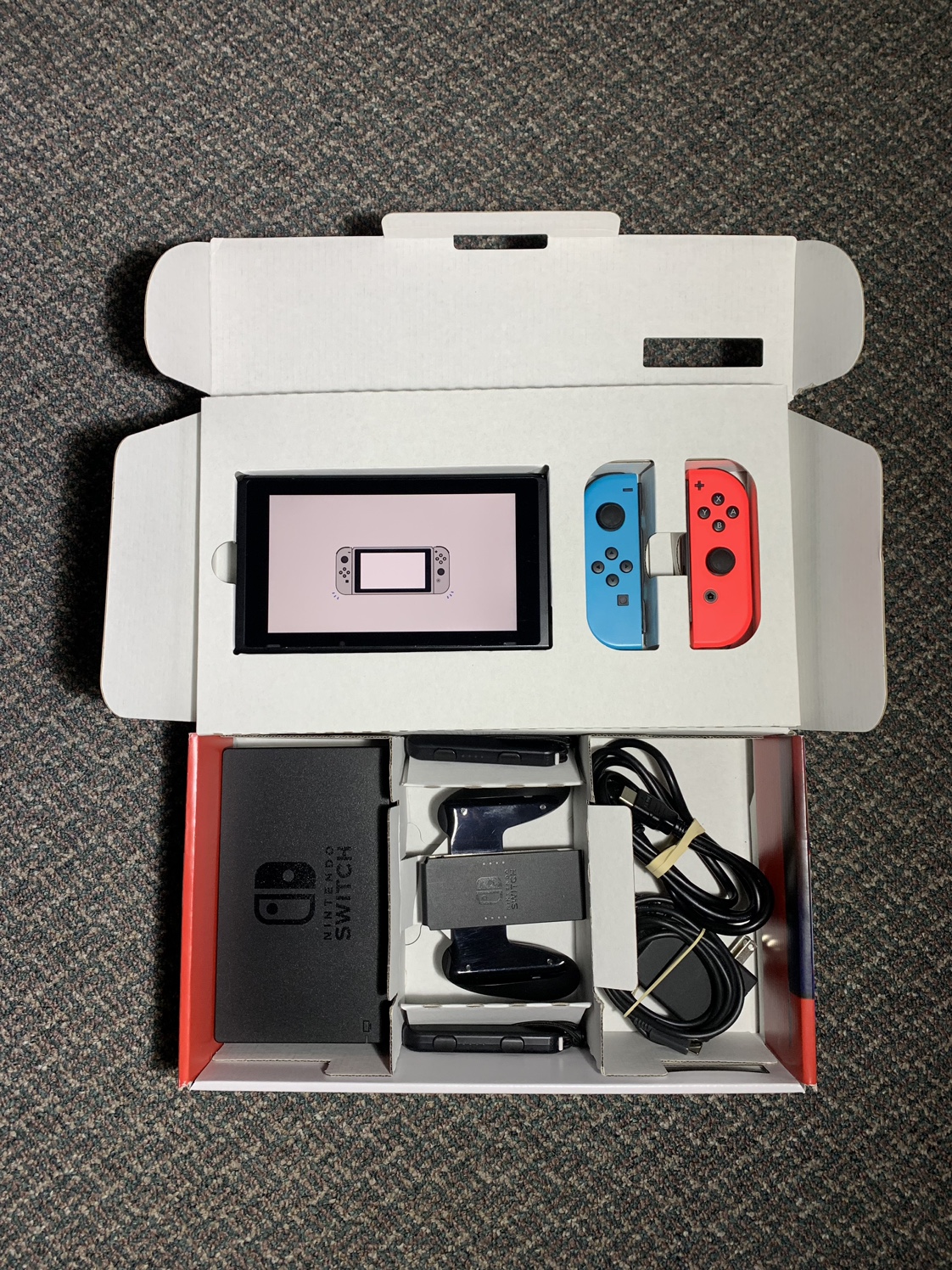 Nintendo Switch Console with Neon Blue and Red Joycons
