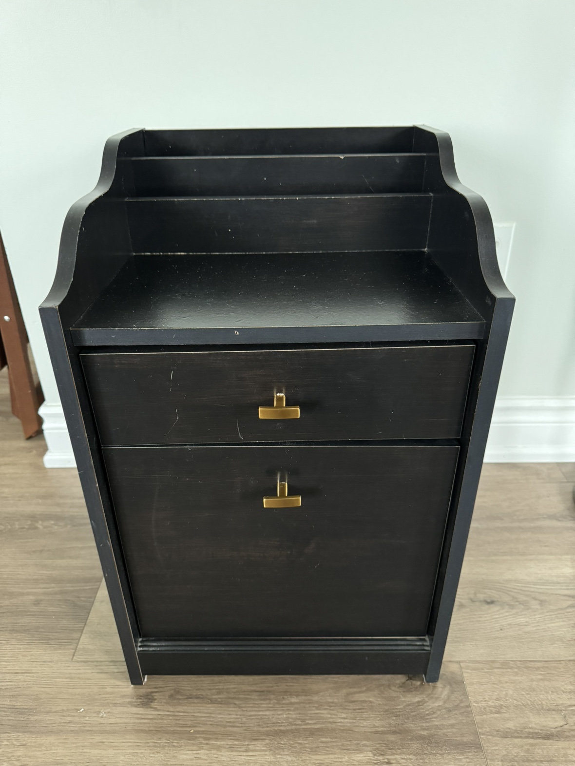 Black night stand with 2 drawers.