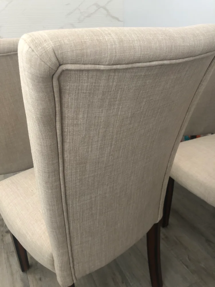Six Beige Upholstered Dining Chairs image indicator(7)