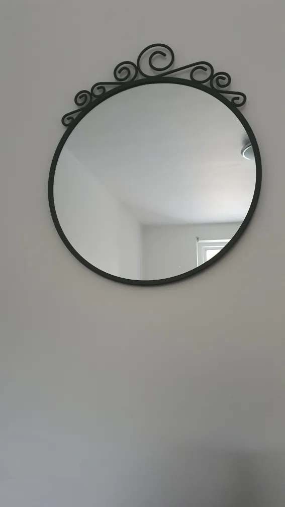 Round mirror with ornate frame thumbnail