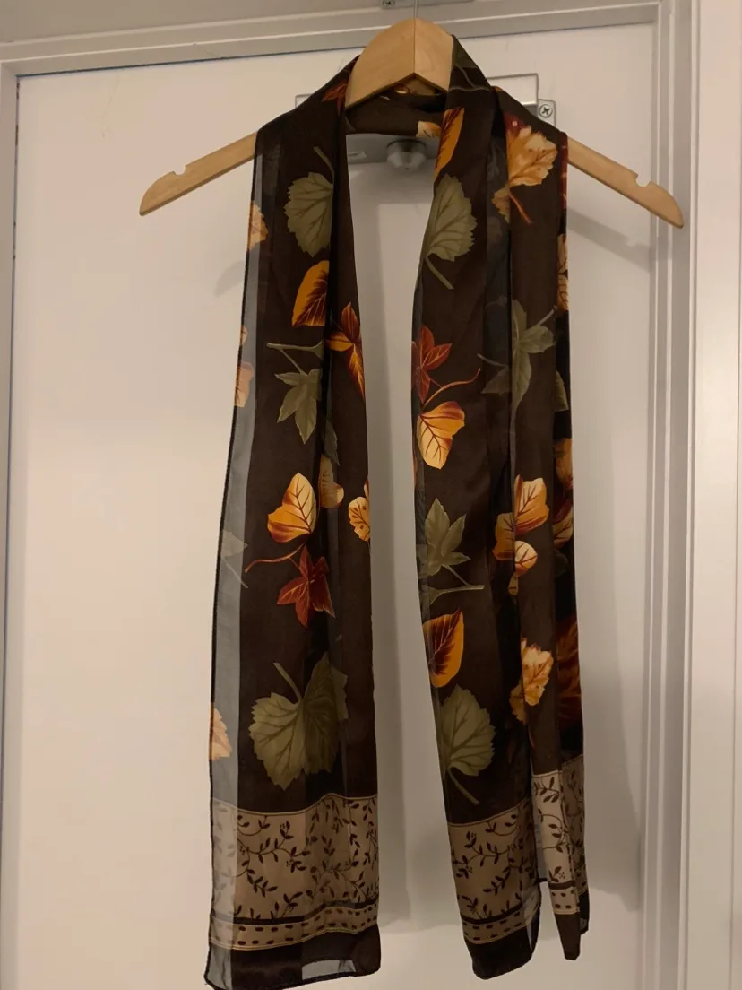 Long Semi sheer brown scarf with leaf pattern image indicator(3)