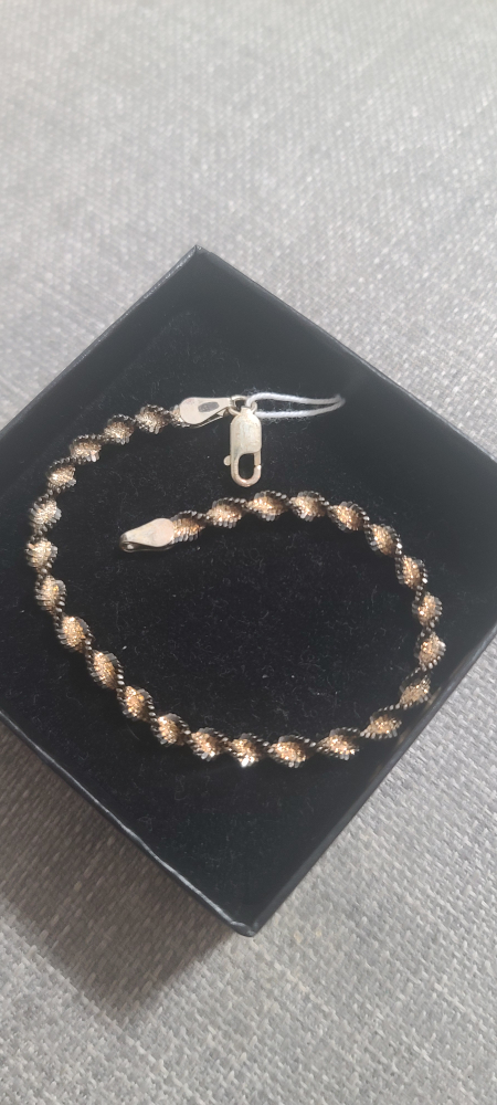 Silver spiral bracelet with golden sections
