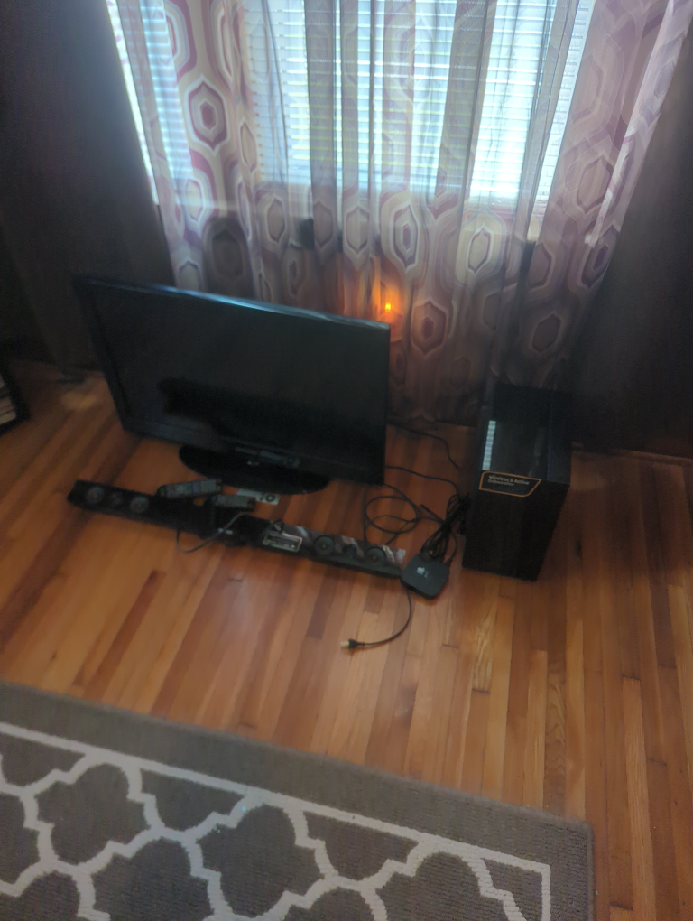 Soundbar with Subwoofer and Samsung TV with Apple box
