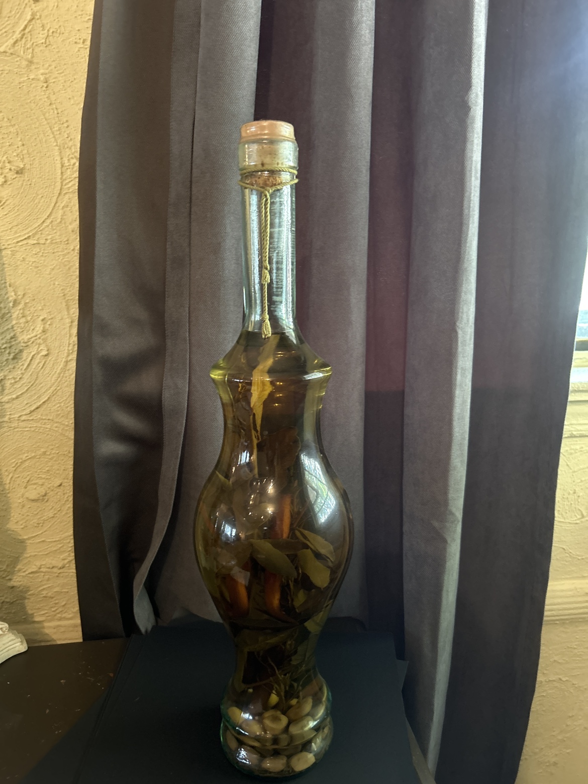 Glass Bottle of Olive Oil with Herbs