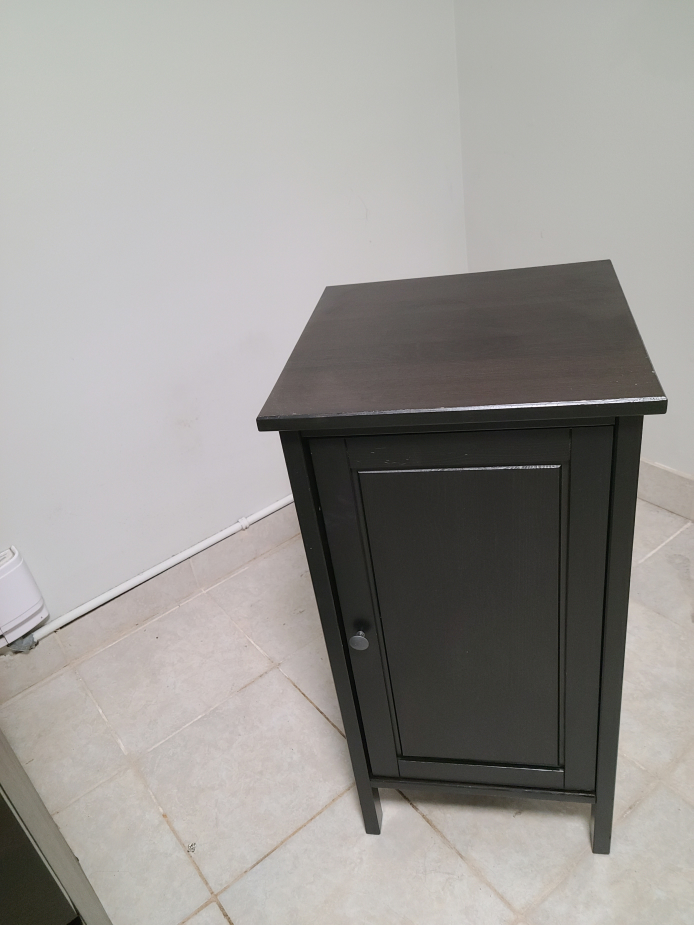 Black nightstand with door and shelves
