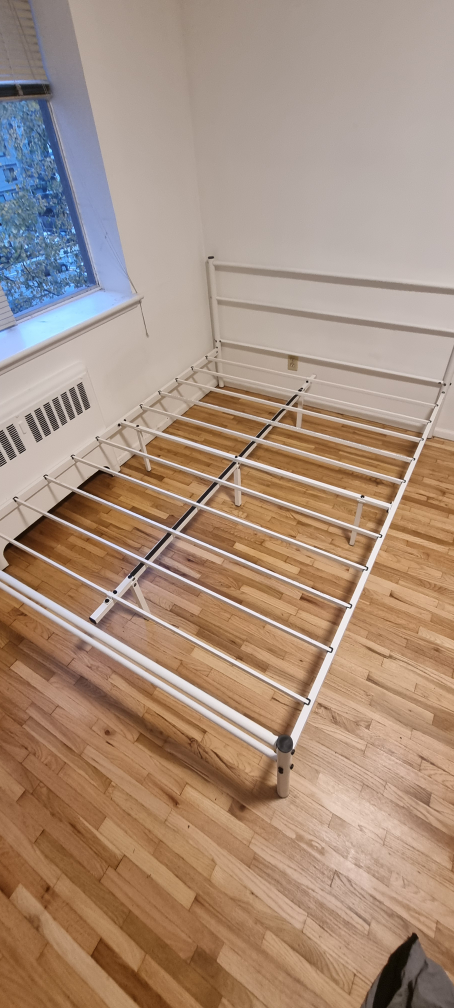 White metal queen bed frame.