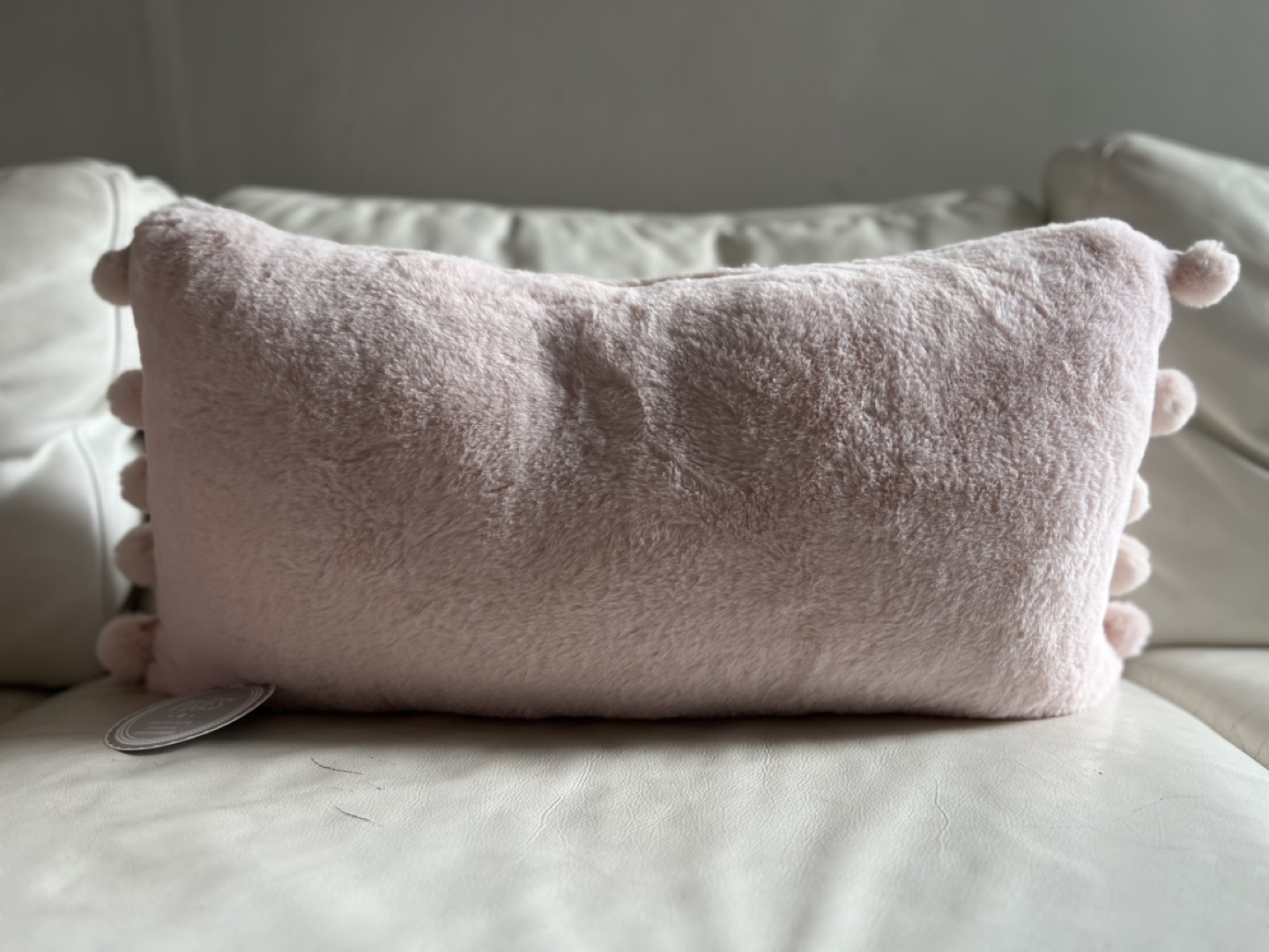 Pink Faux Fur Pillow with Pom Poms