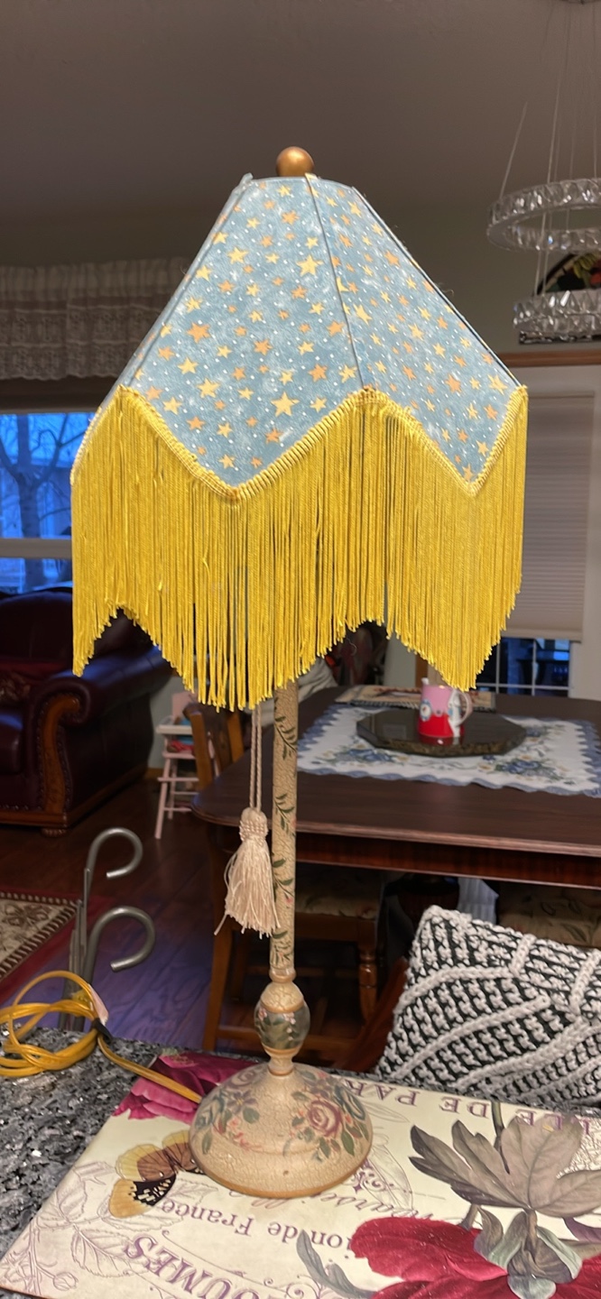 Table lamp with yellow fringe shade