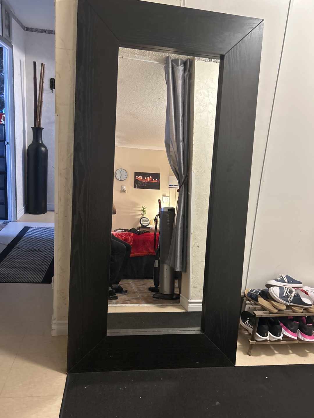 Full-length mirror with black frame