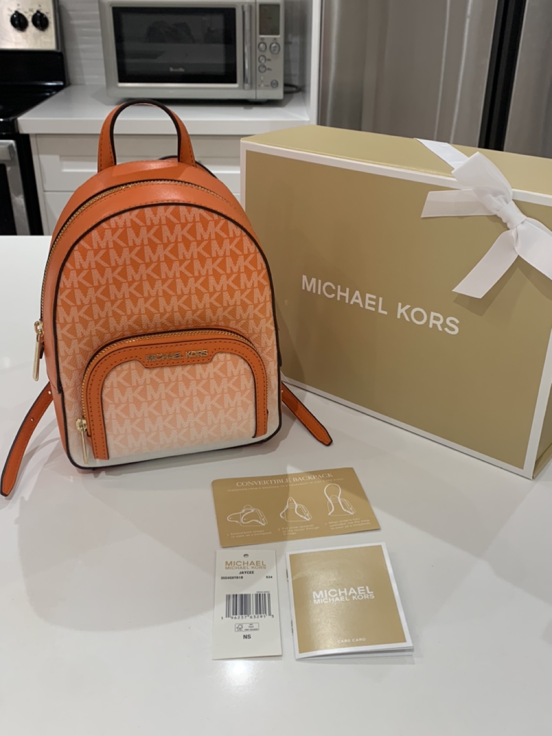 Michael kors orange backpack sale