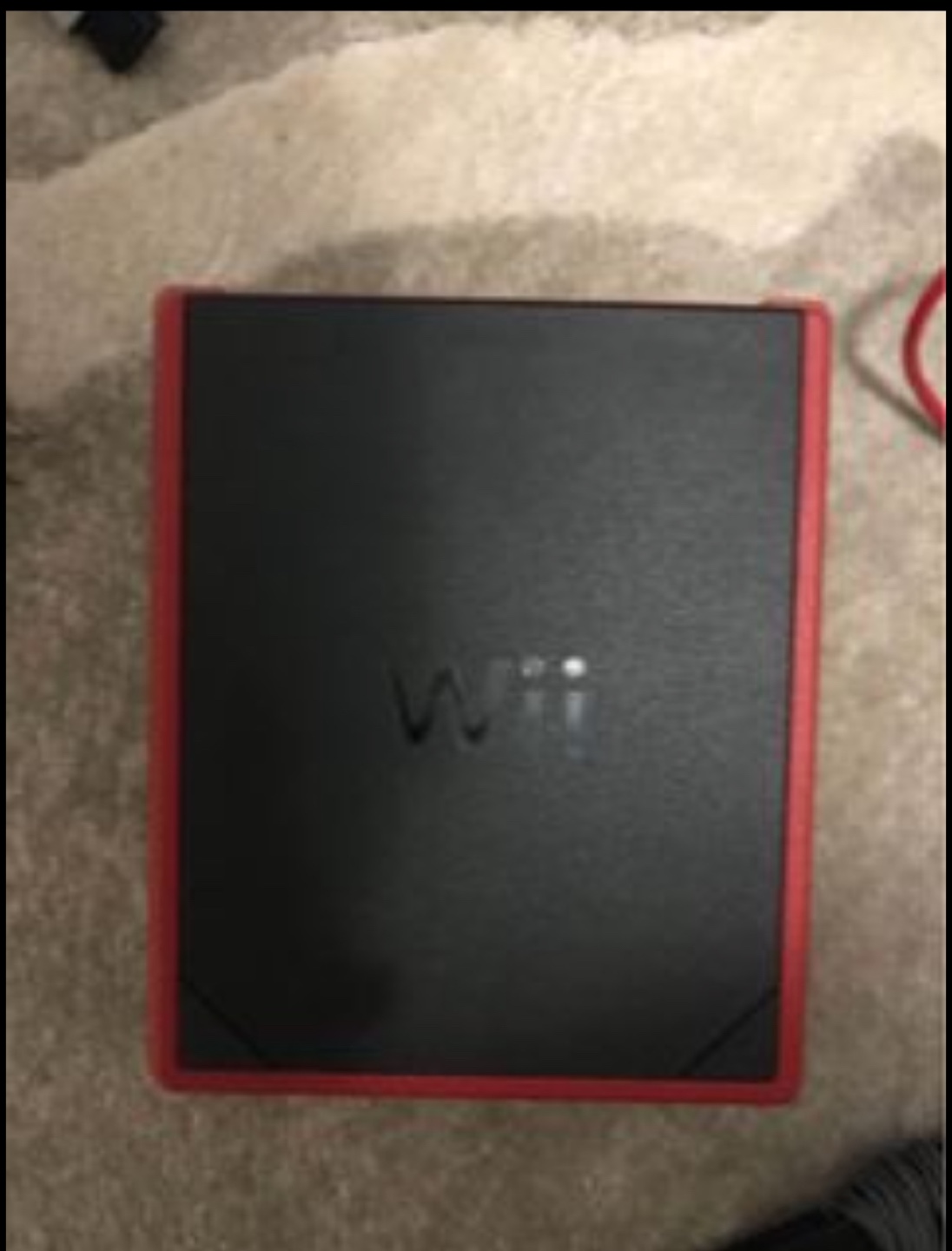Red Nintendo Wii Console with 2 remotes and Mario kart game