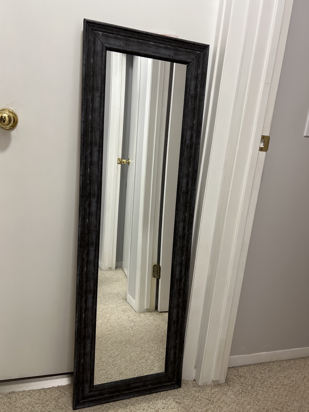 Full-length mirror with black frame