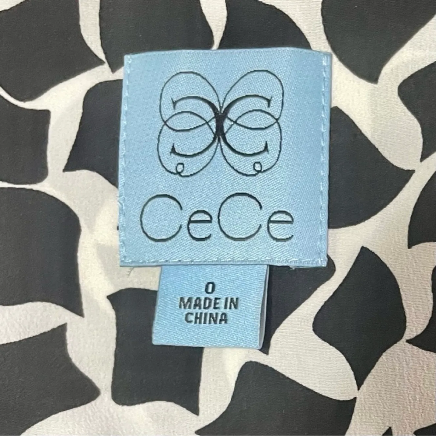 CeCe A-Line Shift Dress White w/Black Patterns with Tie Neck image indicator(9)