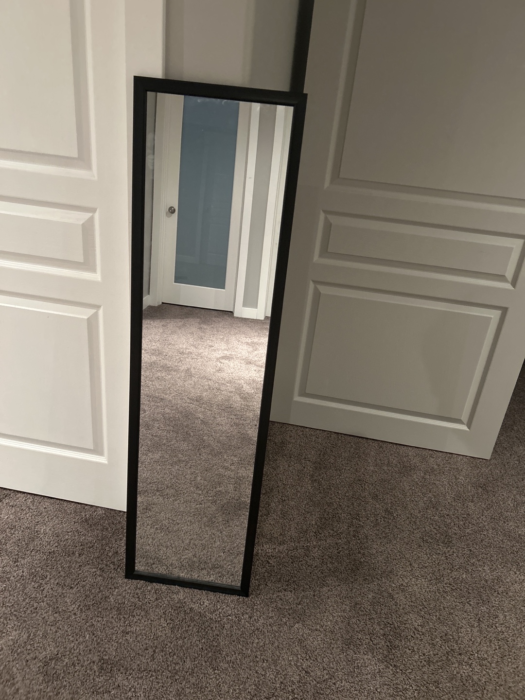 Full-length mirror with black frame