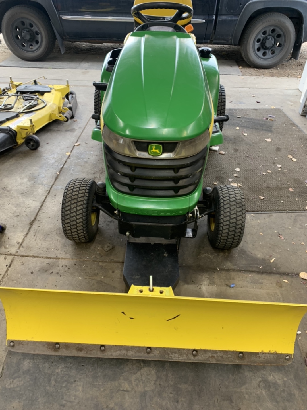John Deere 324X all wheel steer, plus snow blade and chains