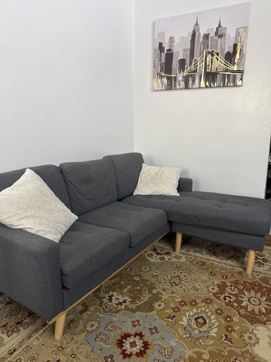 Gray Sectional Sofa with white cushion