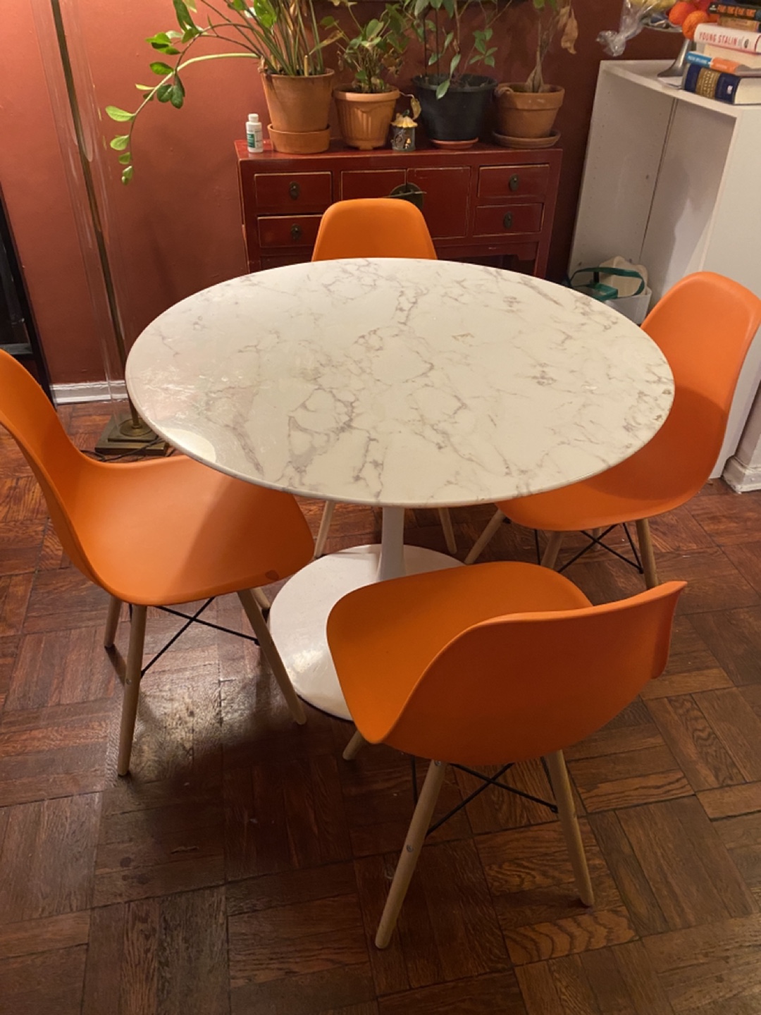 White Marble Dining Table and 4 Orange Chairs