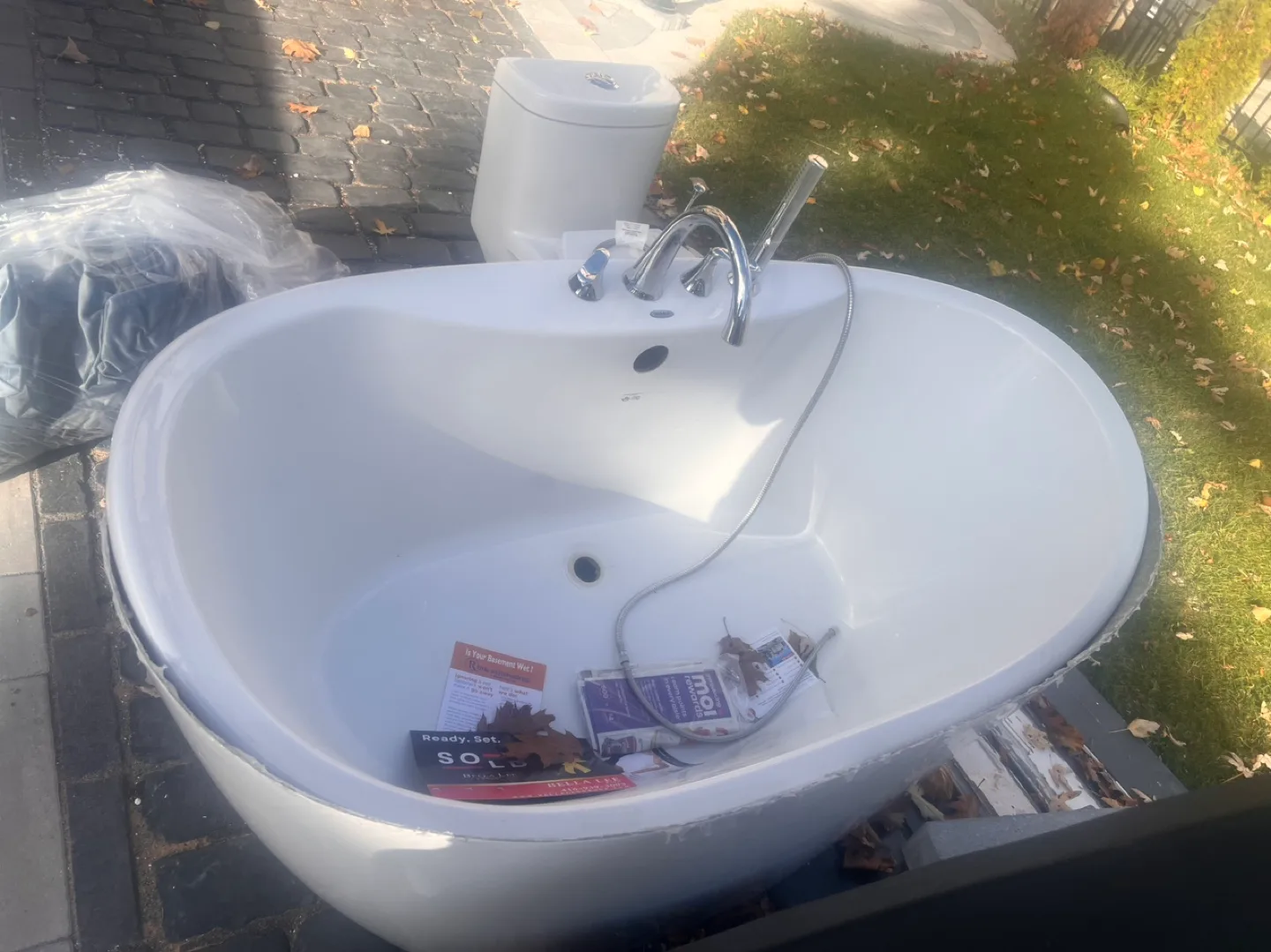 White Oval Freestanding Bathtub with Chrome Faucet thumbnail