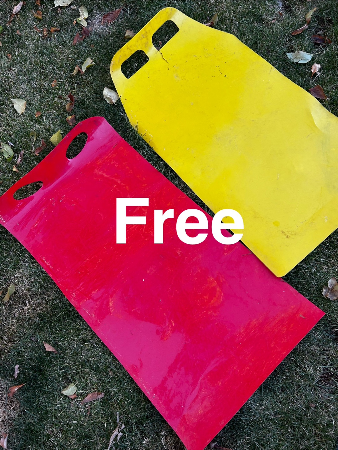 Yellow and Red Plastic Sleds