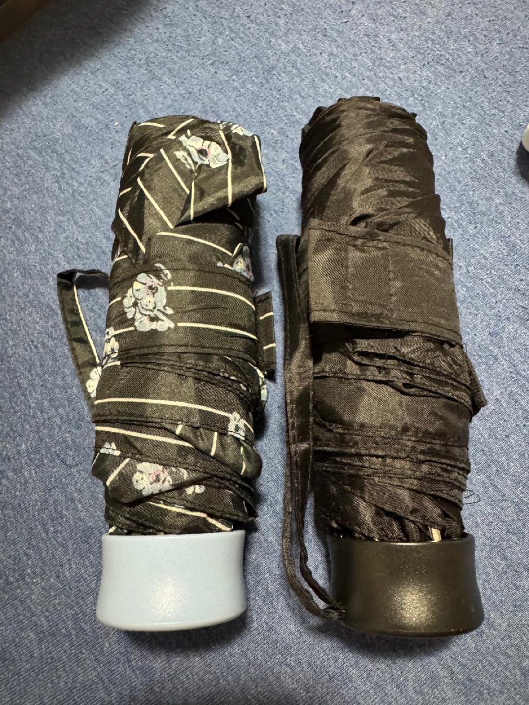 Two Compact Umbrellas