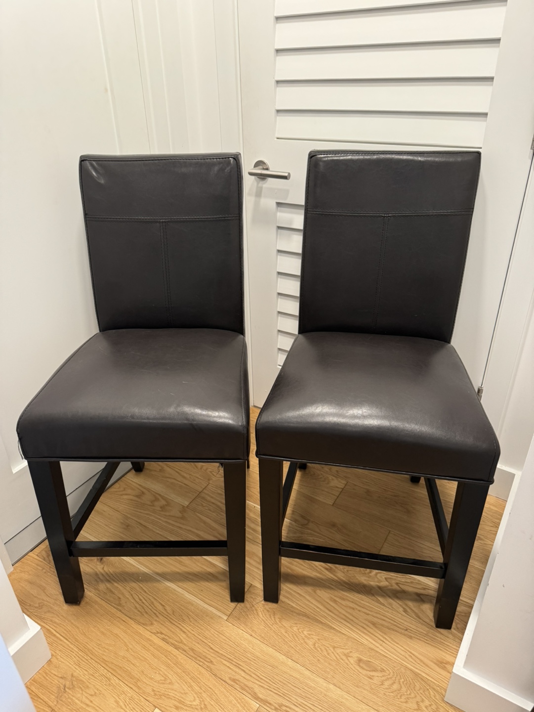 Two Dark Brown Counter Height Chairs
