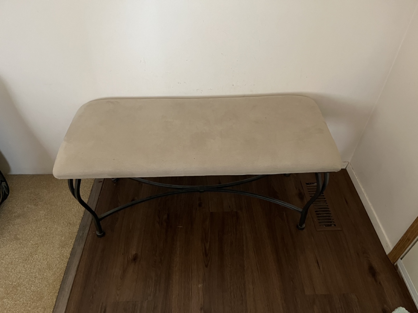 Black Metal Bench with Beige Cushioned Seat