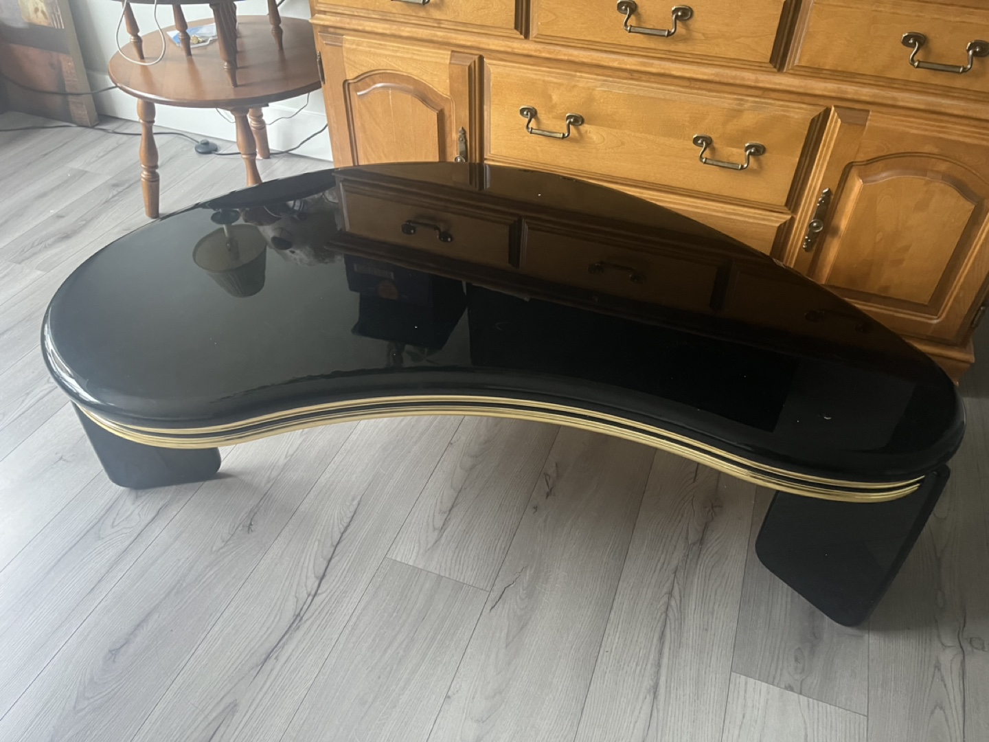 Black and gold kidney shaped coffee table