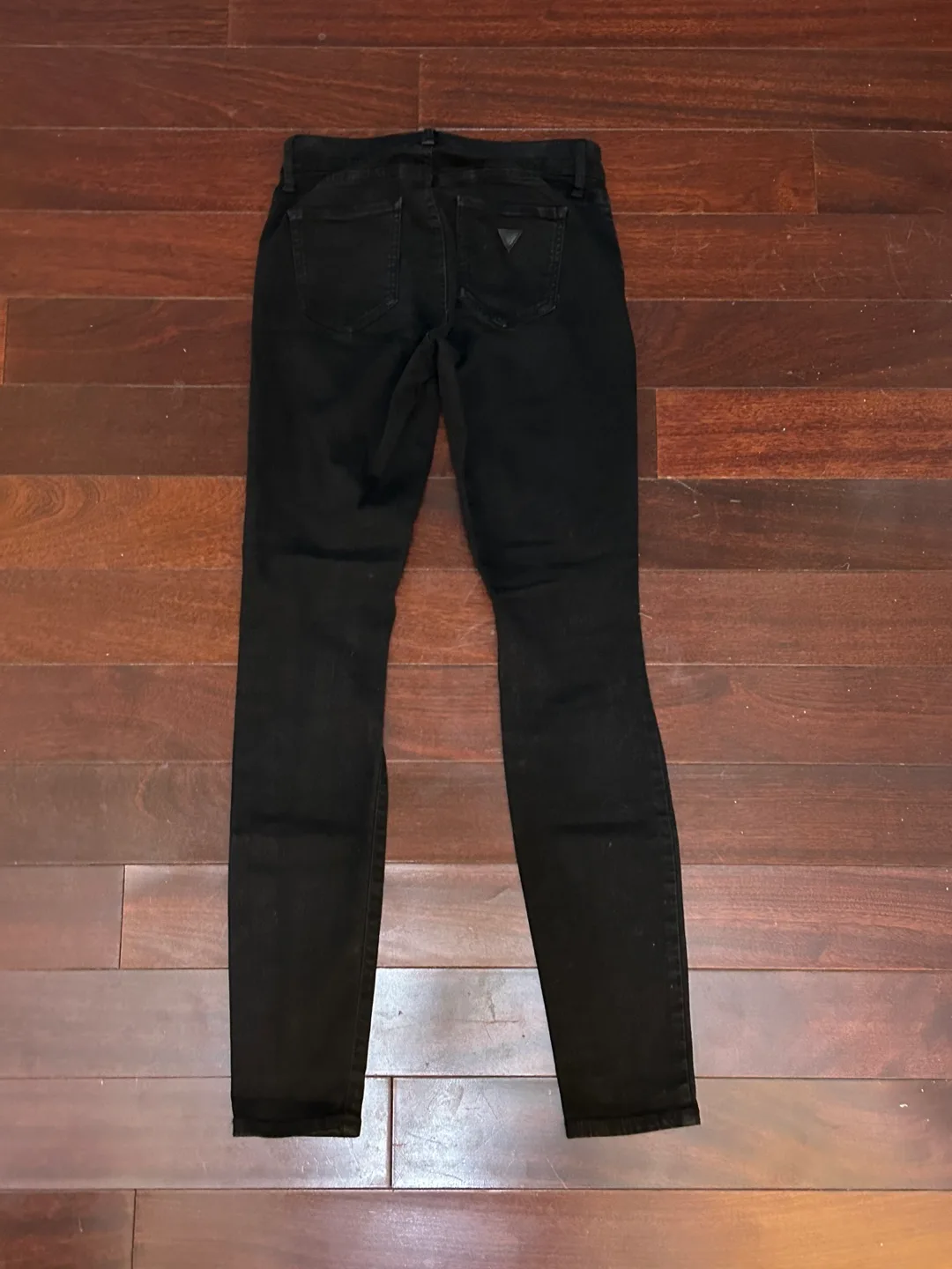 Guess women’s black ripped skinny jeans image indicator(2)