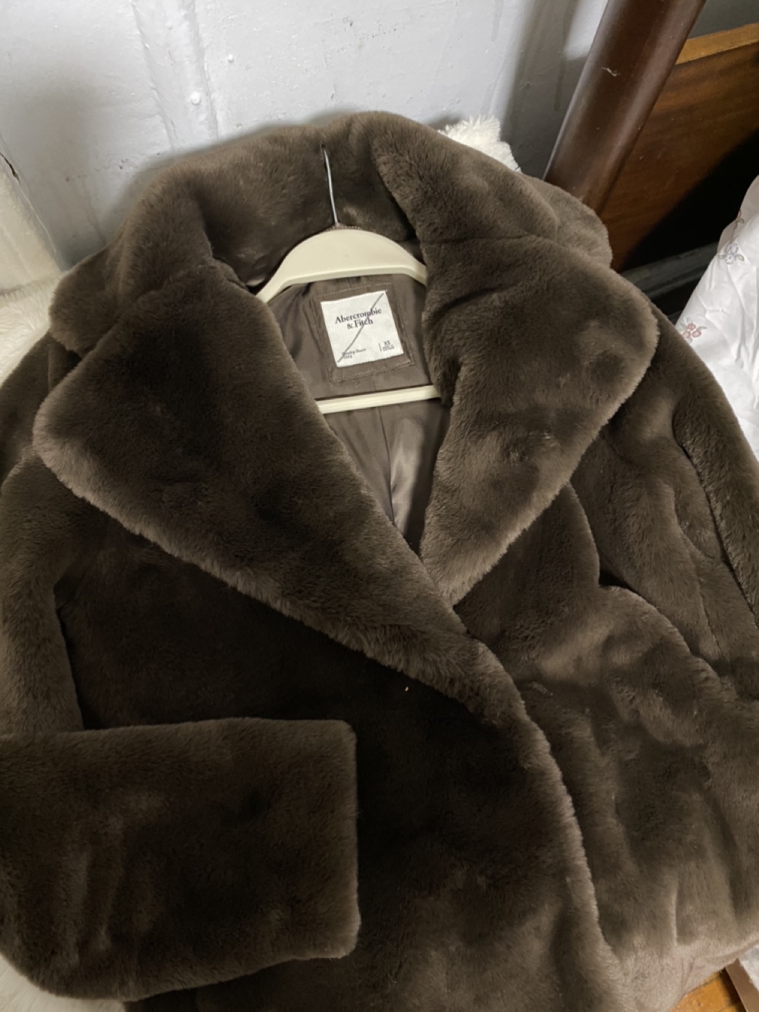 Double-breasted faux fur coat.