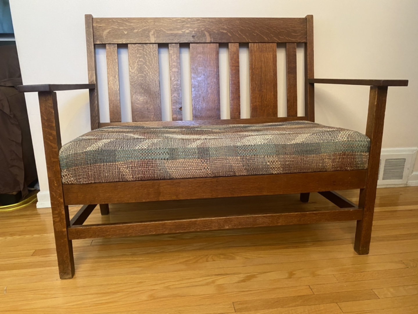 - old fashion wooden bench with tight weave fabric -