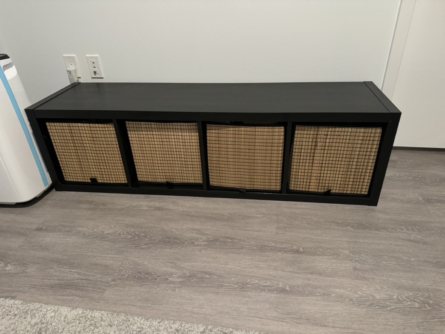 Black/brown shelf with 4 storage baskets