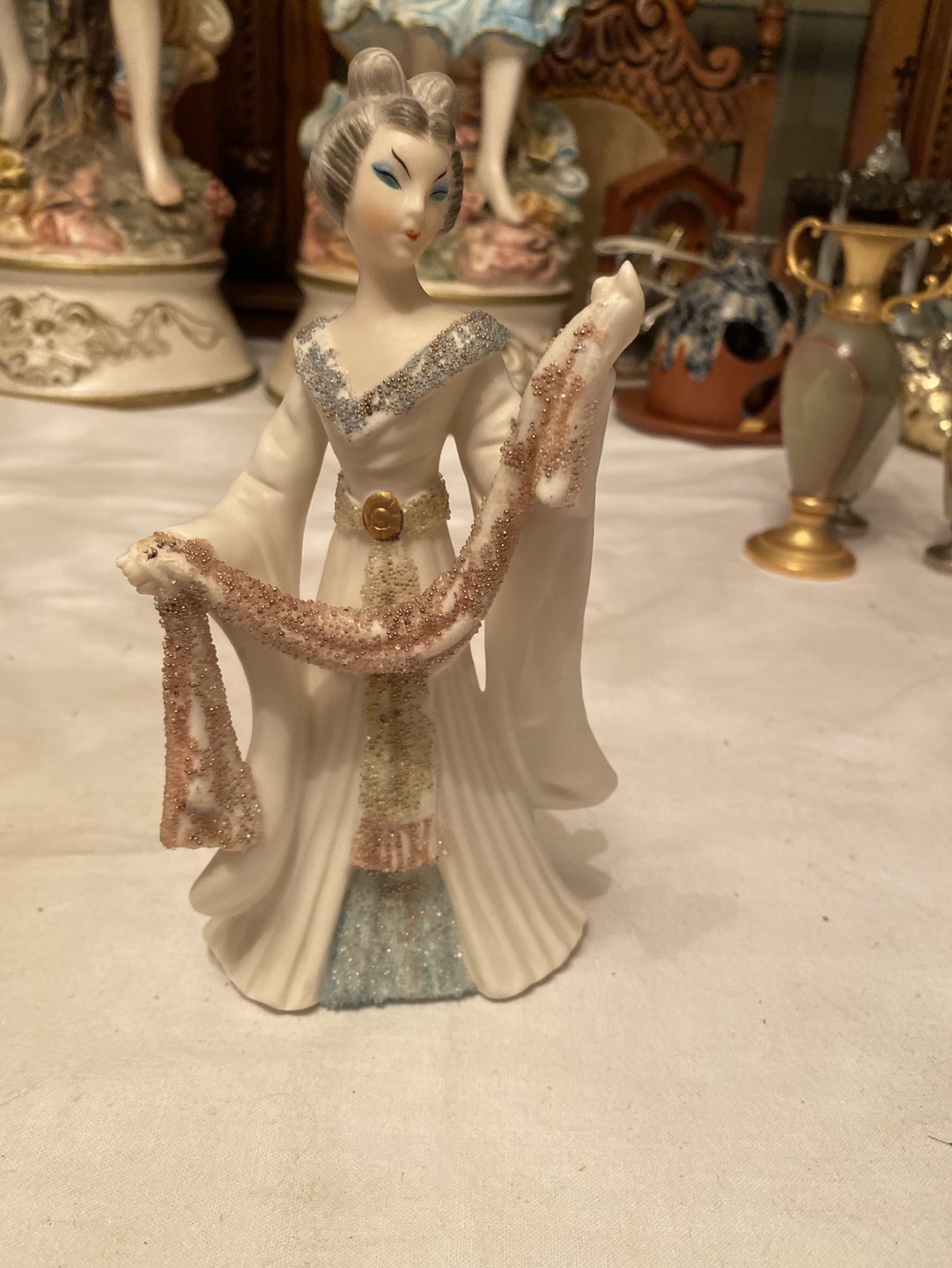 Porcelain Figurine of a Woman with a Scarf