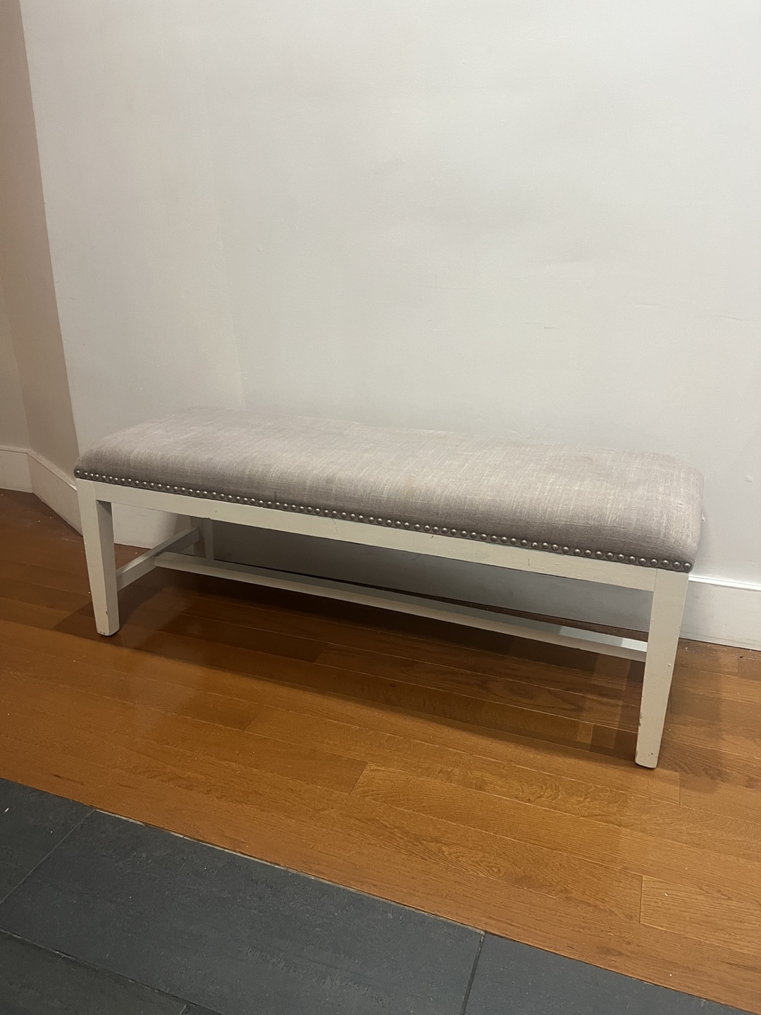 White Bench with Gray Upholstery
