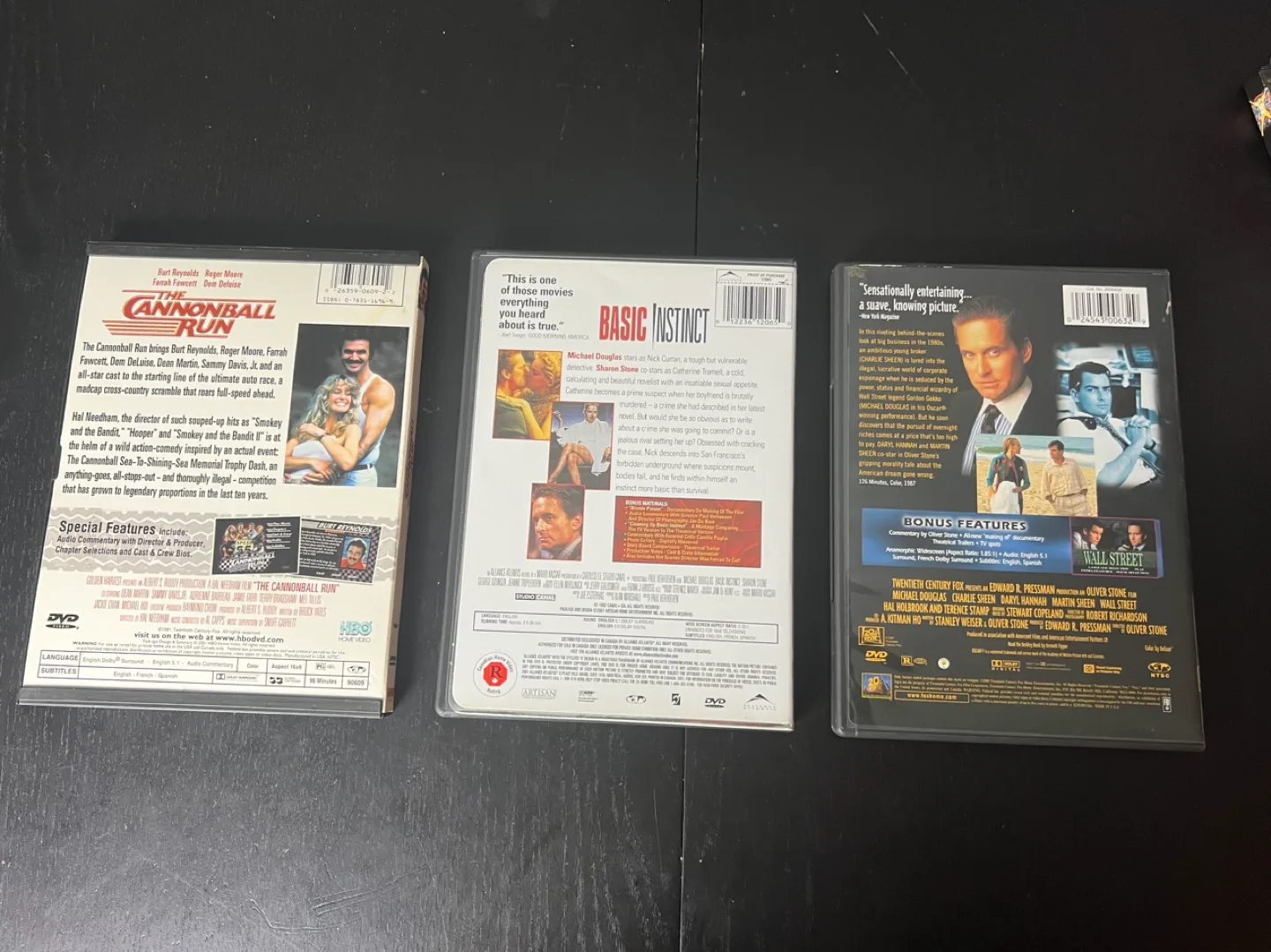 3 DVD Movies - The Cannonball Run, Basic Instinct, Wall Street image indicator(3)