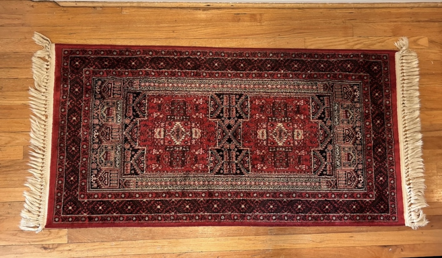 Red and Black Area Rug with Tassels