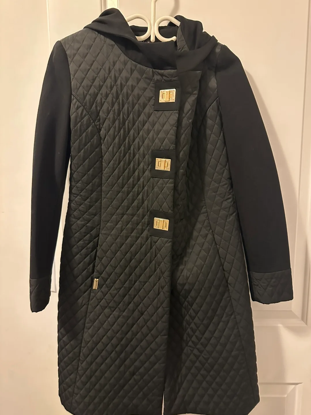 Black quilted jacket with hood thumbnail