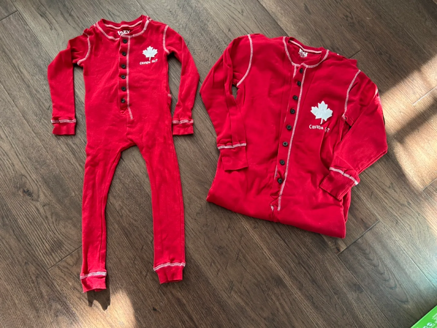 $5 for both! Like New Matching Canada Onsie (size adult S & 4T) image indicator(2)