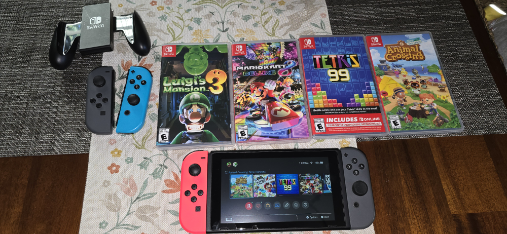 Nintendo Switch with Games and Accessories - photo 2