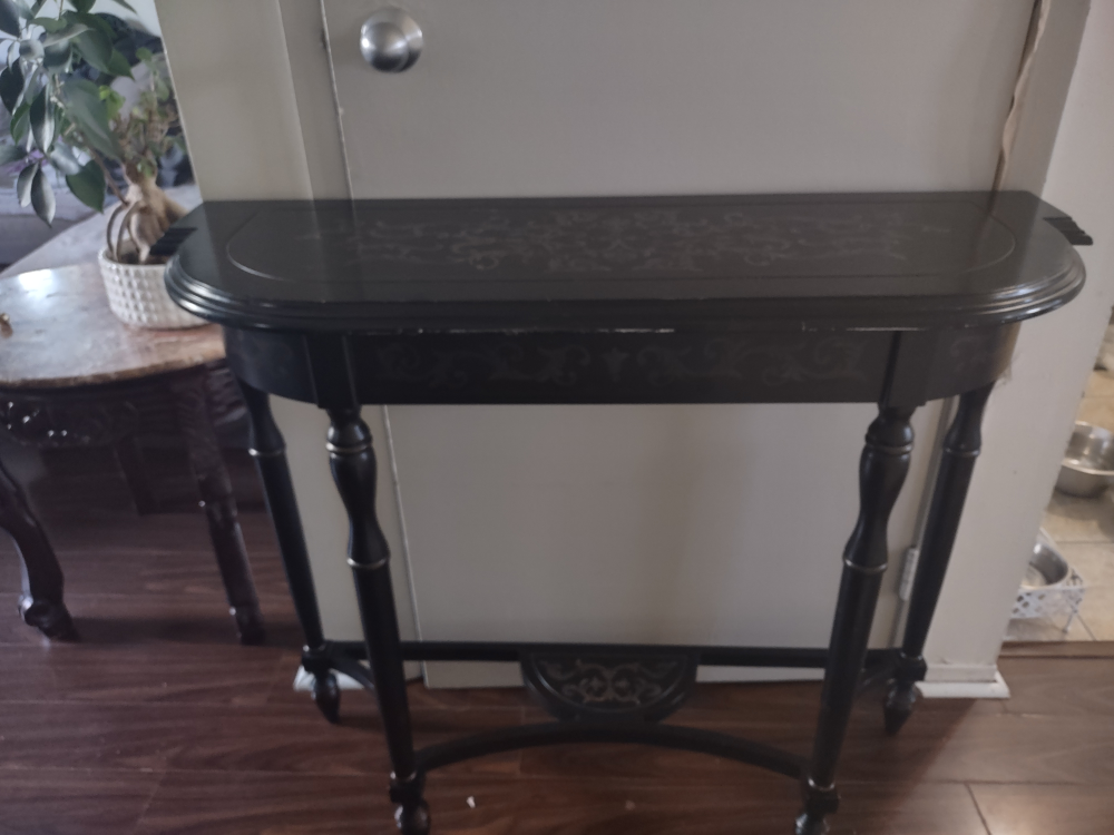 Black Console Table with Intricate Design