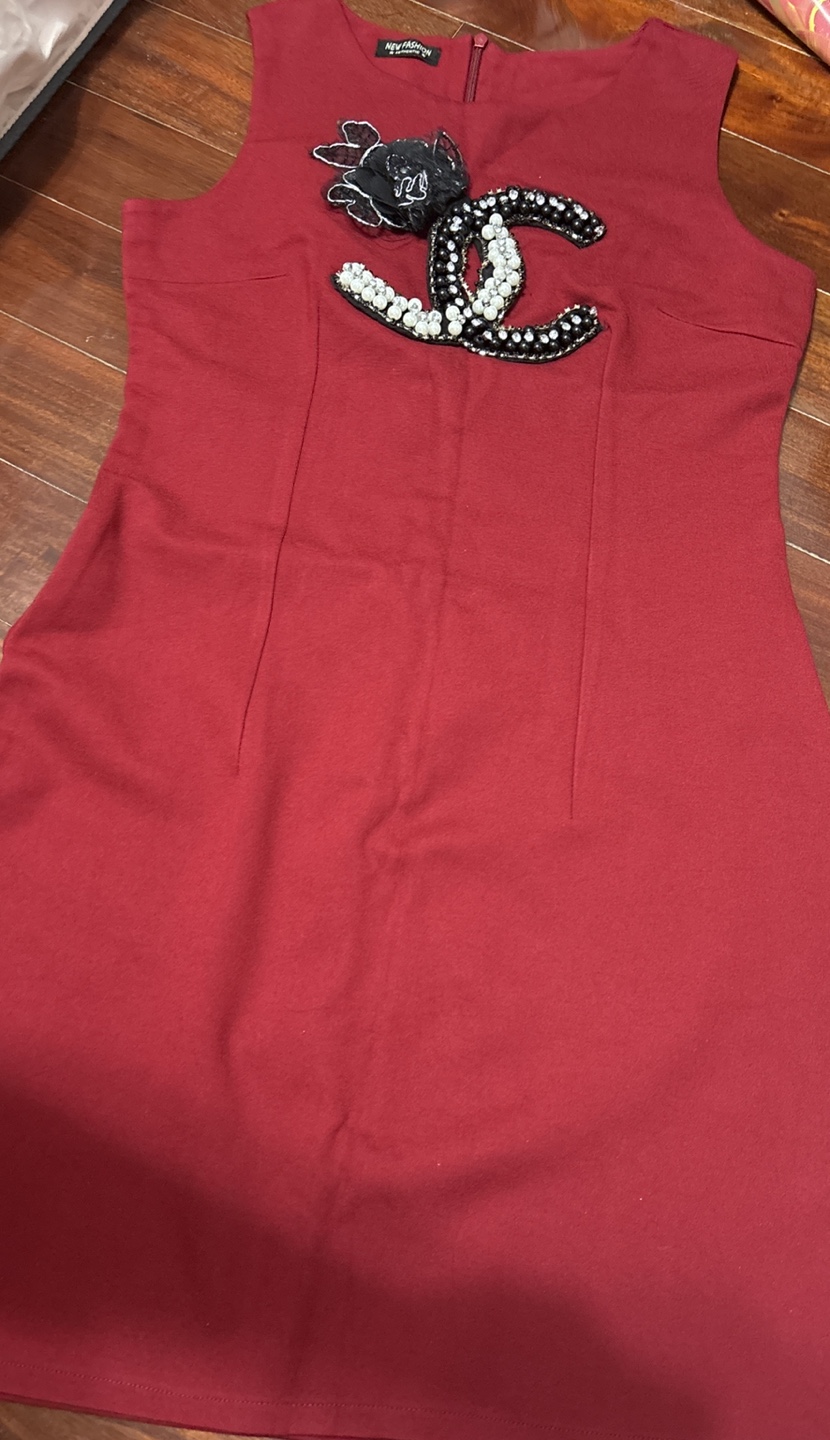 Red sleeveless dress with embellishment