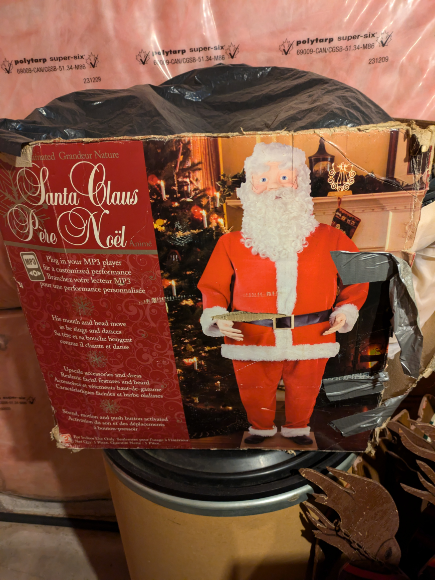 stand up dancing and  singing Santa